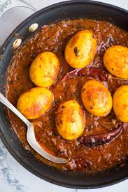 Curry definition, a pungent dish of vegetables, onions, meat or fish, etc., flavored with various spices or curry powder, and often eaten with rice. Dhaba Style Egg Curry The Flavours Of Kitchen