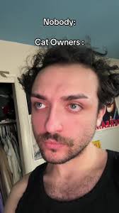 Kevin G Picking Up Cat