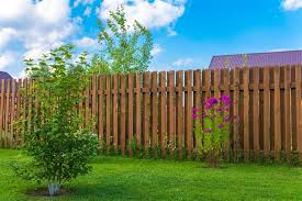 Wood and corrugated metal fence. Wooden Fence Designs That Lend A Rustic Look To Your Garden Gardenerdy