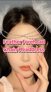 Girl Wears Feathers in Her Hair and A Lot of Rings