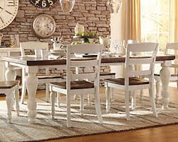 Designed by signature designs by ashley, these plush upholstered chairs will be sure to bring a metro modern feel into your home. Marsilona Dining Table Ashley Furniture Homestore