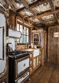 You'll cook or chat in a warm kitchen which blends woody elements of the kitchen with red beadboard kitchen cabinets. Pin By Charlie Johnson On Cabin Ideas Rustic Cabin Kitchens Cabin Kitchens Rustic Country Kitchens