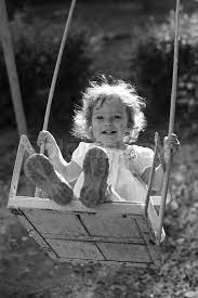 3056983 572162 Child Playing On The Swings Black And White Photo With Yellow Filter Effect Shallow Dep Black And White Black And White Photographs Kids Playing