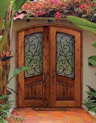 Here are some more front double door deigns in wood which you can consider Beautiful Arch Top Double Entry Doors With Bellagio Wrought Iron Design The Unique Pattern On Th Mediterranean Front Doors Doors And Floors Double Front Doors