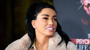 Katie Price cuddles Junior and Princess while visiting her mum Amy