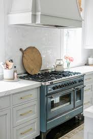 Findinglovely Com Love The Pale Gray Cabinets And That Blue Stove Cabinet Color Is Sherwin Williams Re Interior Design Kitchen Small Grey Cabinets New Kitchen