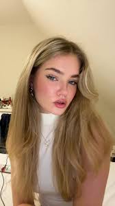 Cozy Attic Style: Blonde Hair and Heart Pendant