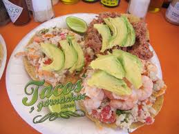 Where and how this mexican icon was born; Tostadas De Ceviche Camaron Y Marlin Puerto Vallarta Mexico Food Mexican Food Recipes Dinner