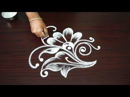 Simple Deepam Rangoli Design On The Top Of Flower Bouquet Simple Kolam Designs For Diwali 2018 Y Simple Flower Design Small Rangoli Design Rangoli Designs