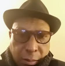 Tim in teacher mode: Guardian Media cameraman, Timothy Chasteau, shows  young residents of Beetham Gardens how far his camera can zoom. They were  amazed at its capabilities. [Image by CARISA LEE]