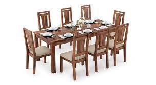 When buying a dining room table and/or planning to create a dining area , it's really important to ensure that you the get the right sized table for the space. Arabia Xxl Martha 8 Seater Dining Table Set Urban Ladder