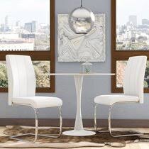 A large, rectangular table adds elegance to a traditional dining room. White Wood Kitchen Dining Chairs You Ll Love In 2021 Wayfair