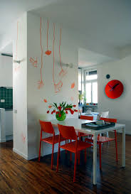 Look through dining room pictures in different colors and styles. Dining Room With A Wall Of Orange Flowers Interior Design Ideas Ofdesign