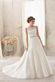 Wedding dress ob7962 whole dress by olivia bottega, sequins bodies and ball skirt with lace and the top is a little bit transparent also could be made with lining as well. Stunning Lace Trimmed Wedding Dress With Crystal Beading Mori Lee Scoop Wedding Dress Chapel Train Wedding Dress Ivory Wedding Dress