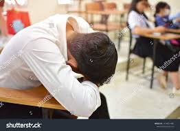 Tired Student Sleeps In Classroom Education Concept Image Of Exhausted Learner Gets A Nap In The Lecture Room Classroom Education Lectures Room Photo Editing
