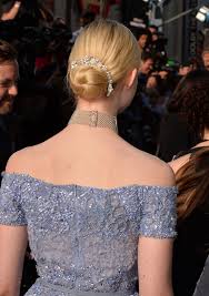 The key is flowing dresses that are more formal than the hairstyle, to achieve balance. Elle Fanning Dresses Up A Bun Hairstyle With A Crystal Hair Accessory Glamour