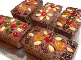 2 cups mixed diced glacéed fruits, 2 cups golden raisins, 1 cup dark raisins, 1 1/2 cups dried currants, 1/2 cup halved glacéed red cherries plus additional for garnish, n/a glacéed red cherries, 1/2 cup chopped glacéed angelica (available at specialty foods shops) plus additional for garnish. Mini Christmas Fruit Cakes Fig Jam And Lime Cordial