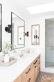 You can choose black and white bathroom ideas to make them look modern and elegant, sure it is a perfect idea, especially when mixing the black goodbye to the old traditional colors such as blue, beige and pink. Beige Wood Dual Washstand With Black Mirrors Transitional Bathroom