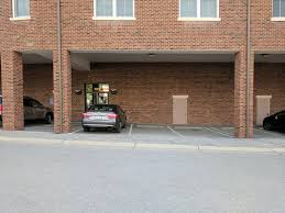This usually only happens in residential areas where. What Is This Type Of Open Covered Parking Under The Second Floor Of A Residential Building Called Ive Been Told Carport Is Incorrect Because They Are Typically Detached Structures Whatisthisthing