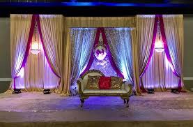 India Wedding Backdrop Stage Decoration With Flower Wall And Fuchsia And Champagne Draping Stage Decorations Wedding Backdrop Wedding Draping Wall