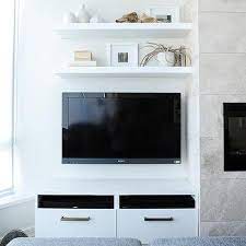 Speaking of putting awkward corners to use, if you don't have an obvious spot for your tv (or you don't want to make it the focal point of the room), consider installing a floating tv stand in. Stacked Shelves Over Tv Design Ideas