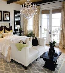 There's a seating area on its end lighted by a glamorous chandelier that hung from the stylish tray ceiling. 37 Startling Master Bedroom Chandeliers That Exudes Luxury
