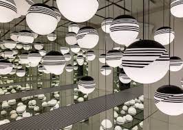 British Designer Lee Broom S Opticality Installation Reflects Lights Into Wall To Wall Infinity Mirrors Lights Light Installation London Design Festival