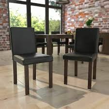 a pair of vintage walnut dining chairs