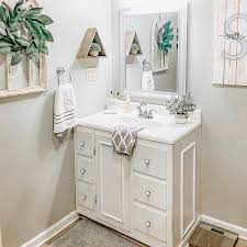 Vanity finishes are typically made of glass, metal or wood and come in a variety of colors. The 70 Best Farmhouse Bathroom Ideas Home And Design