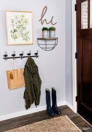 Add Emphasis To Your Entryway With A Simple Chic Gallery Wall Entryway Decor Small Entryway Wall Decor Hallway Decorating