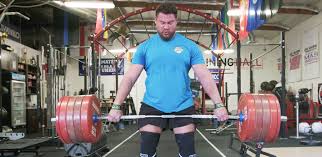 Here's the world's strongest man overhead squatting the world's best tight end. World S Strongest Man Martins Licis Shares His Workout