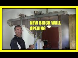 Remove the top course of bricks at the section where the tarp is in place. How To Remove A Brick Load Bearing Wall New Opening Youtube