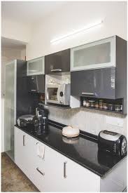 This cad model can be used in your kitchen design setting our cad details. White Kitchen Cabinets With Black Marble Counter Top By Shyama Viswanathan