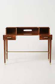 Whether tackling taxes or working on your next big novel, this writing desk is here to help. Zelda Burl Wood Brass Desk