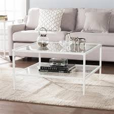 The coffee table has an extending top that lifts up to provide a footing raised work surface. Boston Loft Furnishings Kerym 32 In X 32 In X 18 In Soft White Frame And Clear Glass Top Rectangular Coffee Table Atg0173 Rona