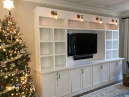 In this build i create a 13ft tall bookshelf with a rolling ladder. Modern Built In Bookcase Modern Built In Built In Bookcase Custom Lighting