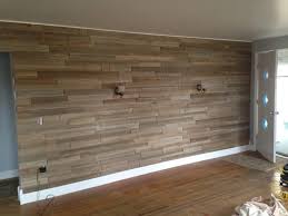 If you placed positioning nails in the wall in step 4, remove them now. Easy Plank Wall Install