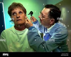 Dr. Paul Maddox examines Daisy Brewer at Maddox's office Dec. 7, 1999, in  Campton, Ky. The 74-year-old doctor still practices medicine after 46 years  in the Appalachian community. (AP Photo/Rhonda Simpson Stock