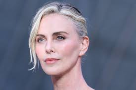 See Charlize Theron's Sleek Sporty White Minidress