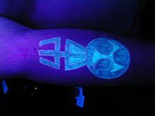 Black light tattoos, also known as uv tattoos because they react to ultraviolet light, are done with a specific ink containing uv reactive chemicals. Uv Tattoo Wikipedia