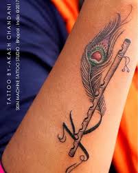 Peacock Feather With Flute Freehand Designed With Initial K For Her Two Little Sons Krishna And Kanha Tattoo By Aka Krishna Tattoo Feather Tattoos Tattoos