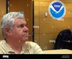 Florida, USA. 6th Oct, 2016. Hurricane specialist Richard Pasch watches nhc  director Rick Knabb give a briefing Thursday am