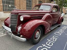 Image result for Trojan Maroon 1939 Oldsmobile
