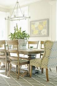 Wing chairs were designed to be pulled up to the hearth, their tall sides and backs keeping the heat from the fire in and the chills out. Wingbacks In The Dining Room Dining Chair Design Circular Dining Room Dining Room Interiors
