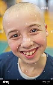 New York, USA. 19th March 2013. RYAN ROSENBLUM, 13, of Merrick, has just  had his head shaved at St. Baldrick's fund raising event at Calhoun High  School. The Long Island school exceeded