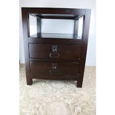 I use it to keep pictures and all the accouterments that go with organizing photo albums in the drawers, and the shelf is a great place to keep the albums in easy reach for people to. Campaign Style Pottery Barn Rhys End Tables A Pair Chairish