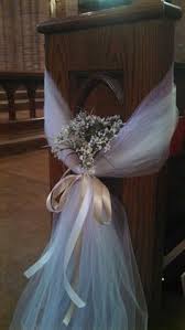 Church Pew Decorations This Was So Easy To Do With Some Long Pink And Beige Tule And The Same Colors Of In 2020 Wedding Pew Decorations Church Pew Wedding Wedding