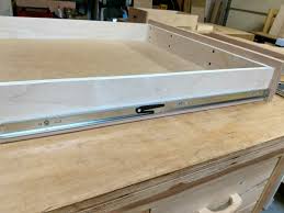 Side mount slides have a tab or lever which will release the drawer typically located about halfway down the side of the drawer when in the open position. Install Full Extension Drawer Slides Easy Diy The Definitive Guide