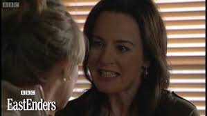 Dr. May Wright holds Dawn Swann hostage