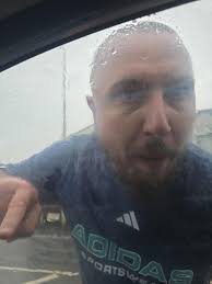 A car caught in a flood at Stainmore after a heavy downpour caused a stream  to flow over the bridge. (Beamish Museum Collections)